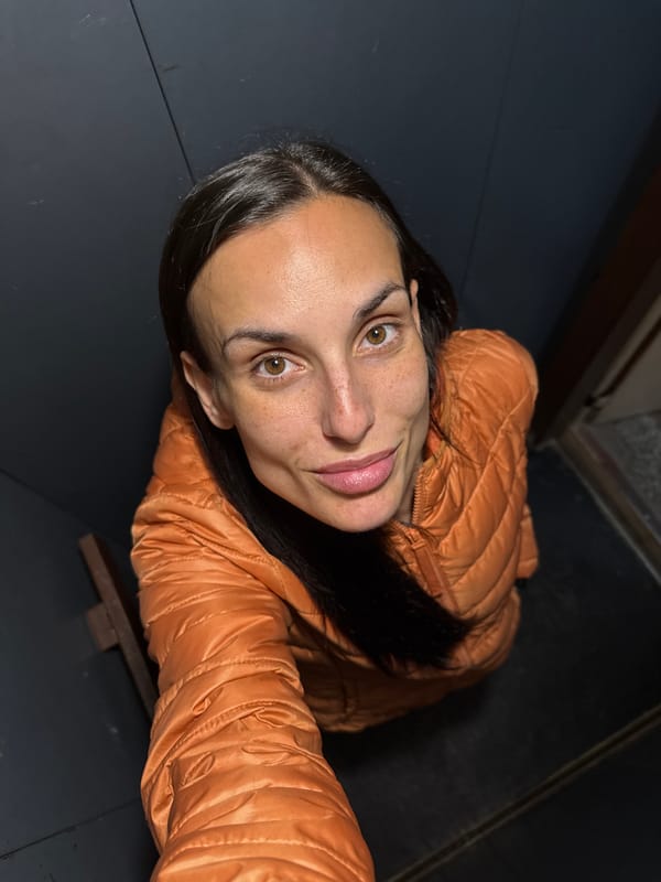 Woman in tan jacket photographed indoors in Pleven