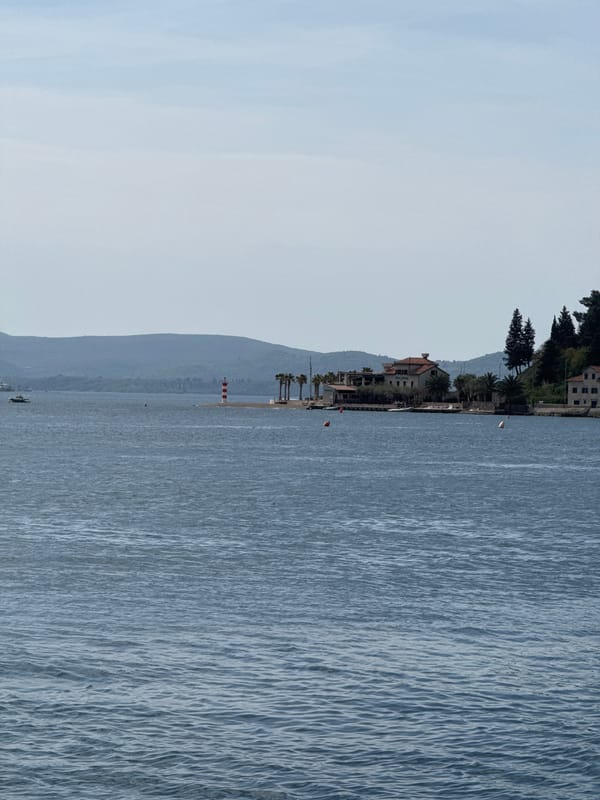 Ferry crossing documented near Montenegro coast with motorcycle passenger