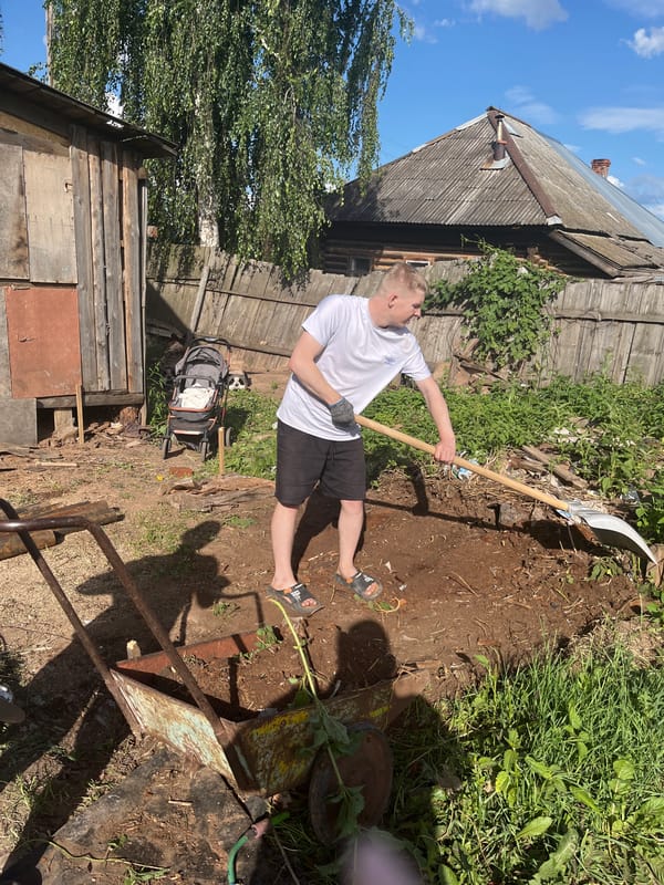 Yard work and family moments at a rural Russian homestead