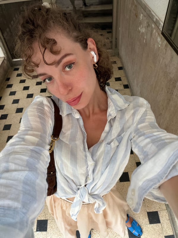 High-angle selfie on a checkerboard floor in Tel Aviv