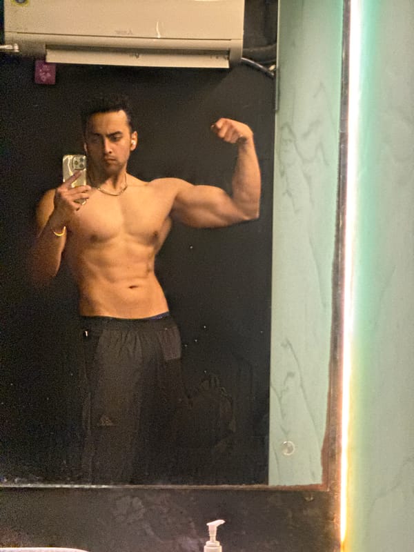 Young man takes fitness selfies in Kolkata gym facility