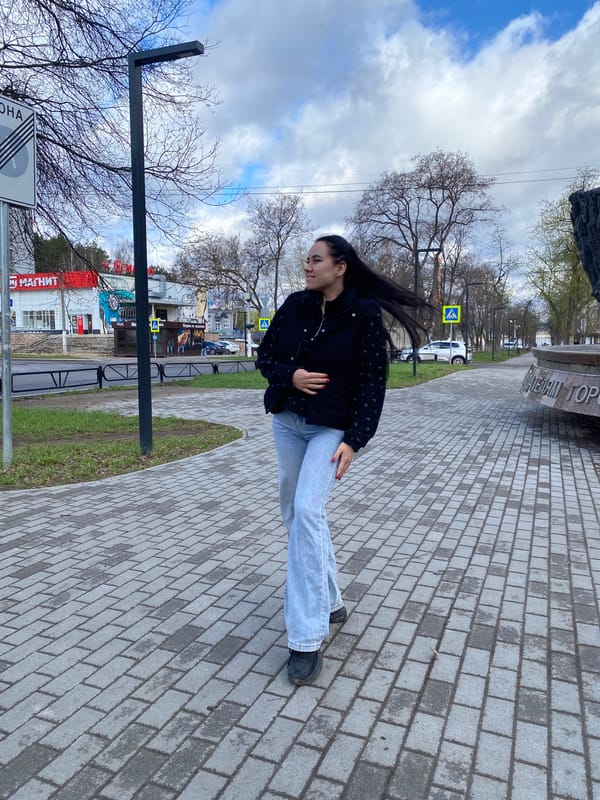 Young women photograph monument visit in Chaikovsky, Russia