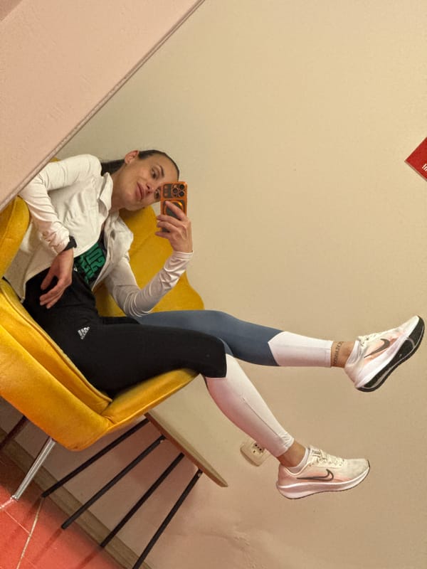 Woman takes mirror selfies on yellow chair in Pleven