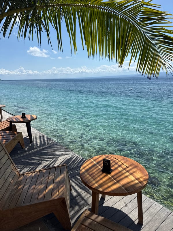Morning relaxation on wooden deck at Nusa Penida waterfront