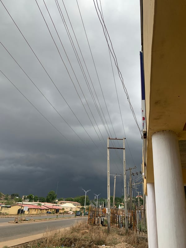 Storm clouds gather over Jos streets as traffic continues