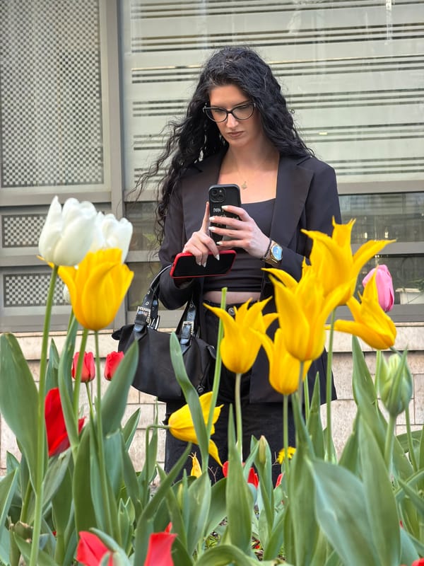Woman in business attire spotted near tulips in Belgrade