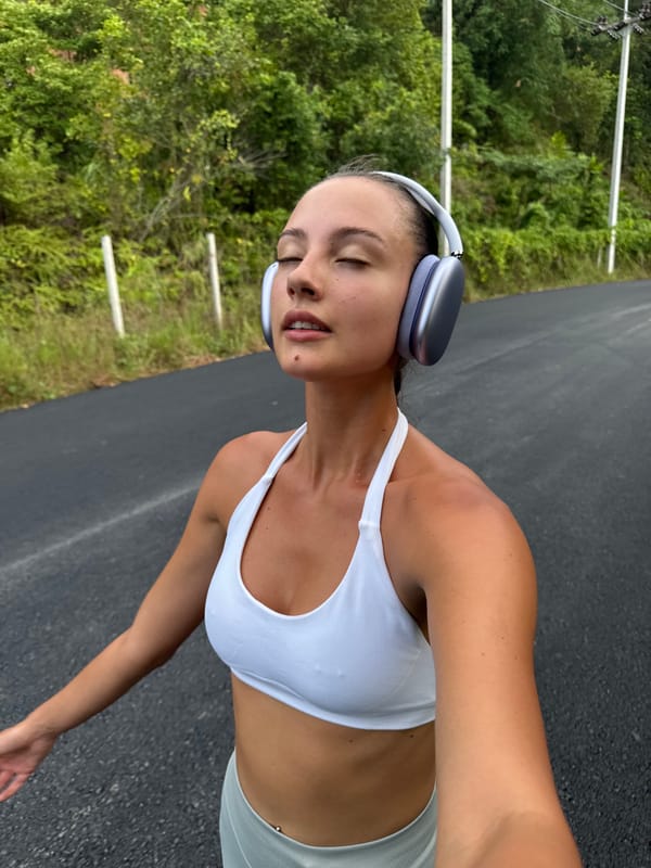 Woman takes selfie during walk on Chalong road
