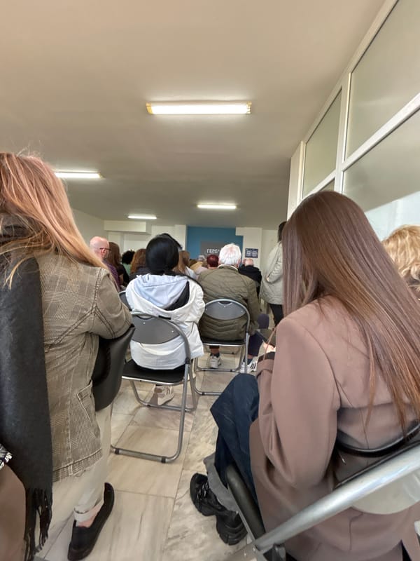 People wait in government office chairs in Varna