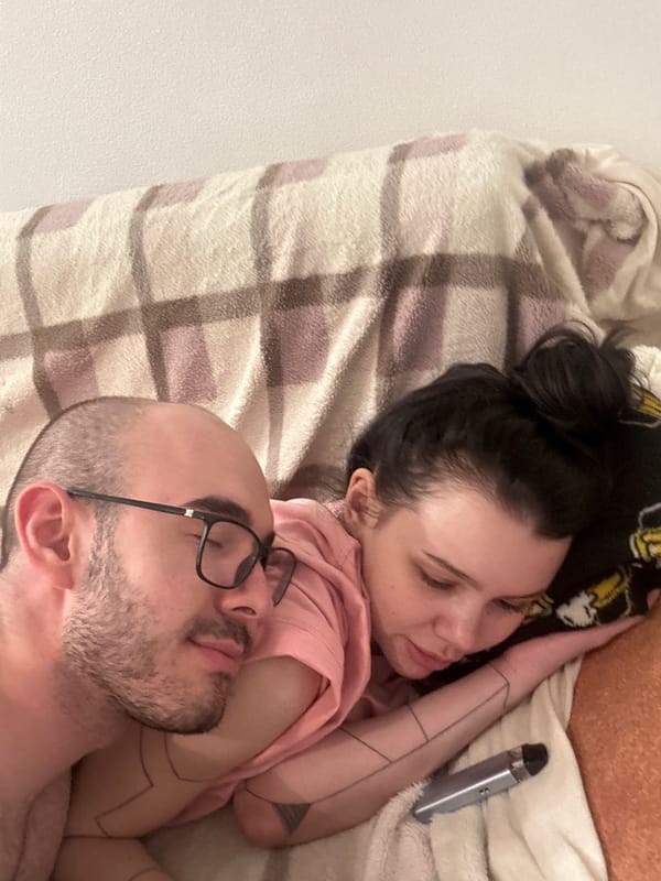 Couple photographed resting together in Lyubertsy bedroom