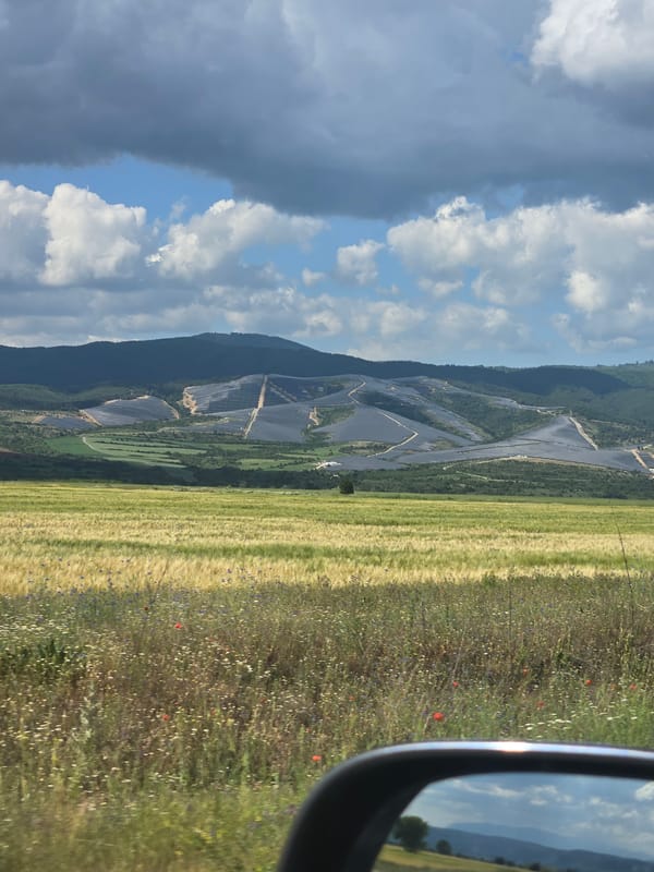 Rural road journey documented through countryside with solar panels