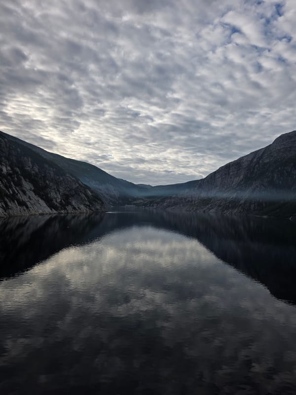 Glomfjord's rugged fjord and waterside power station, Norway