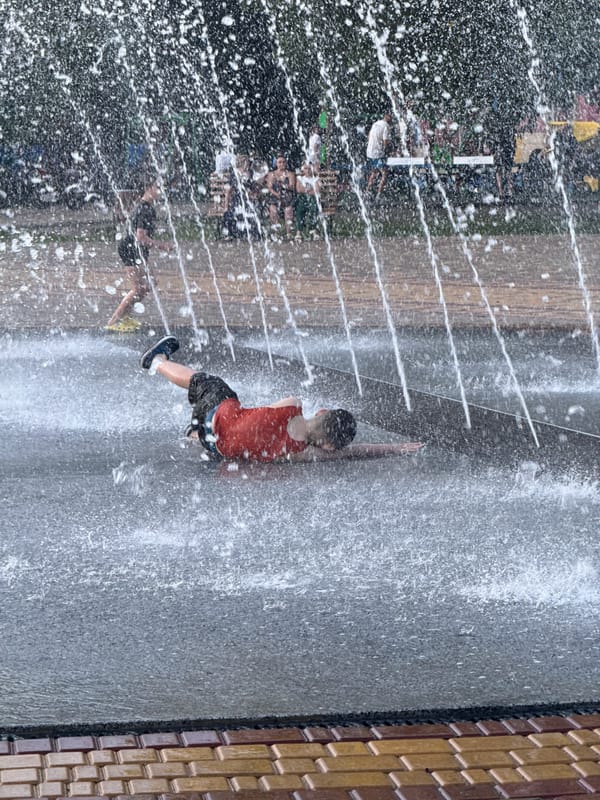 Summer afternoon at a Ukrainian park fountain and plaza