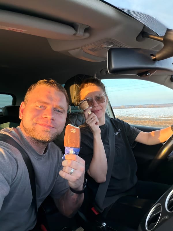 Couple enjoys ice cream treats while sitting in car