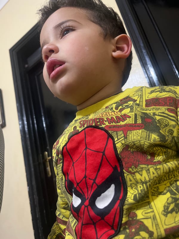 Child photographed in Spider-Man shirt indoors in Morocco