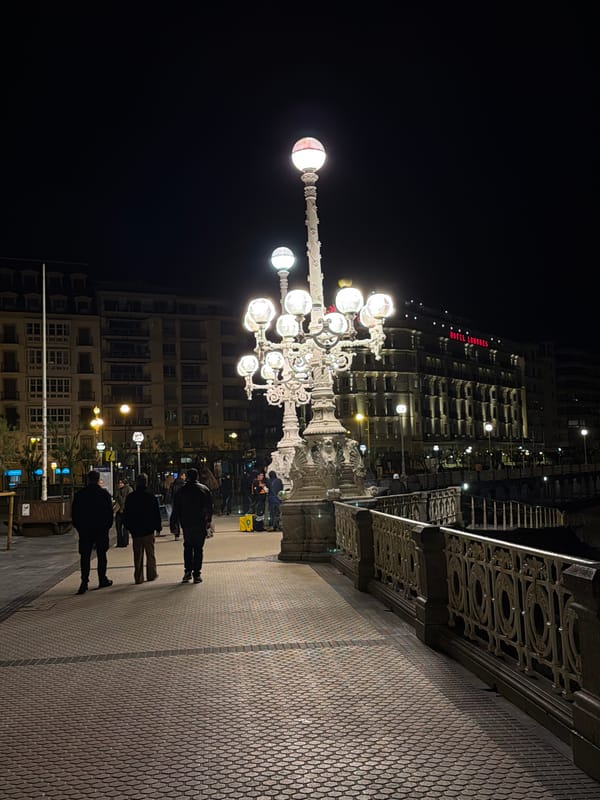Evening pedestrians gather near Fnac store in San Sebastián