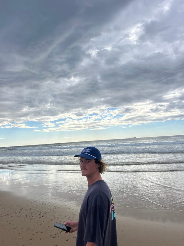 Evening beach gathering at Bulli Beach draws multiple visitors