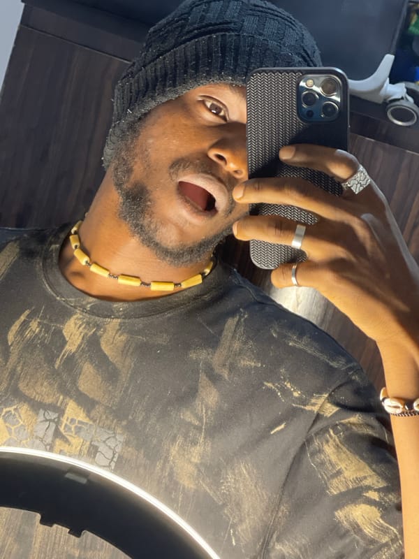 Selfie session in Abuja, beanie and beads throughout.