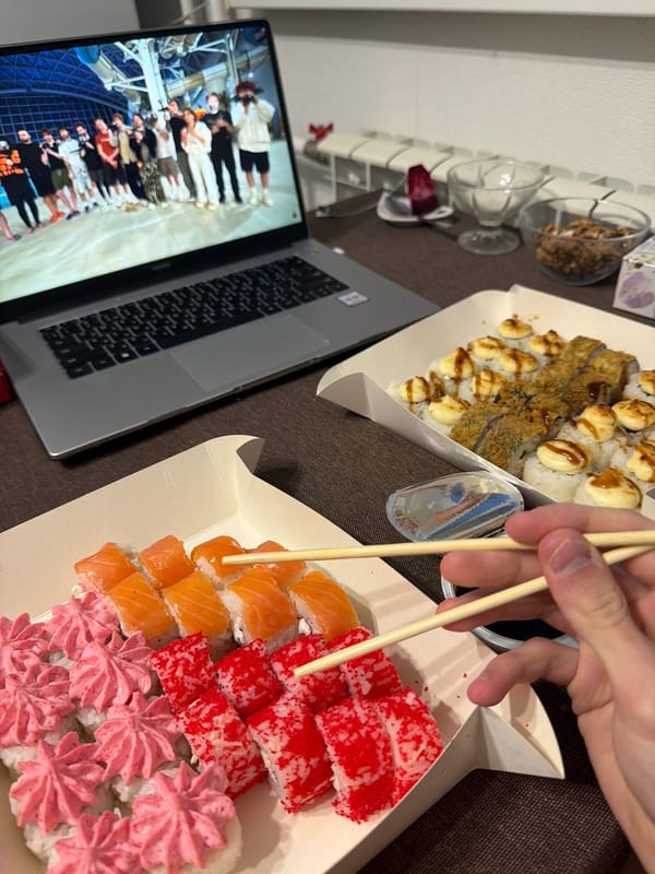 Casual sushi meal with laptop captured in Yekaterinburg