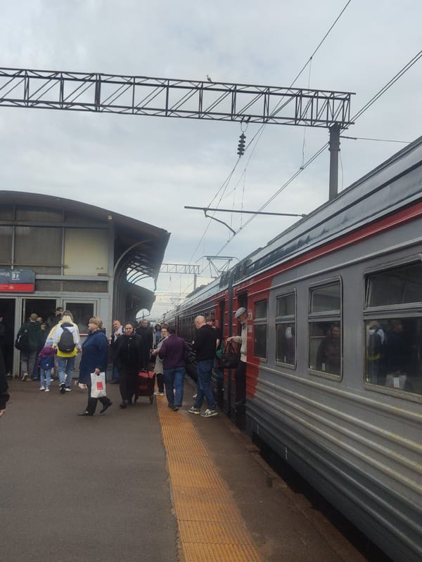 Morning commuters board blue subway train in Saint Petersburg