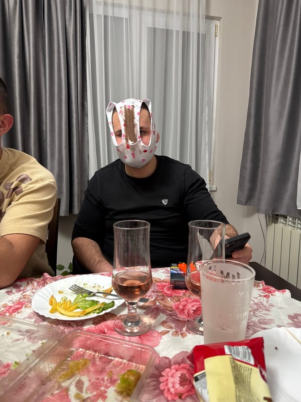 Man with heart-patterned headwear photographed at table in Bulgaria