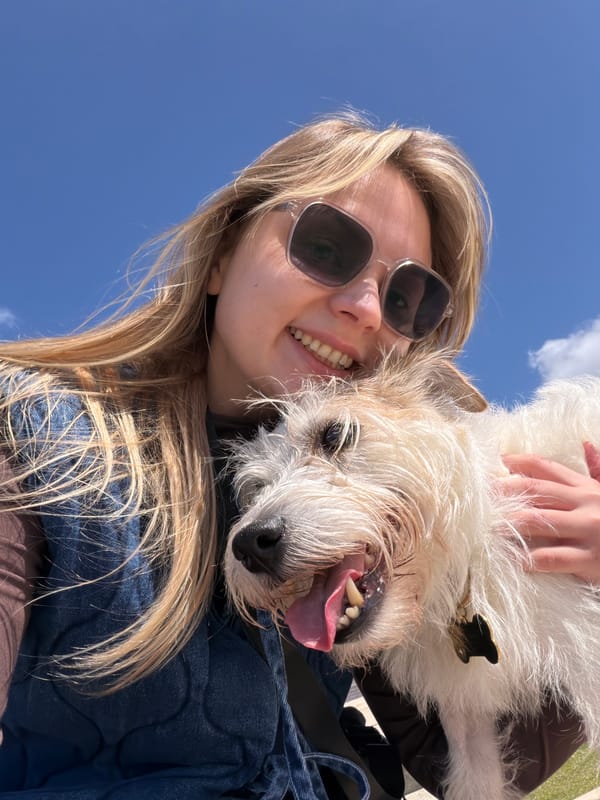 Woman and dog enjoy sunny day at Tel Aviv beach