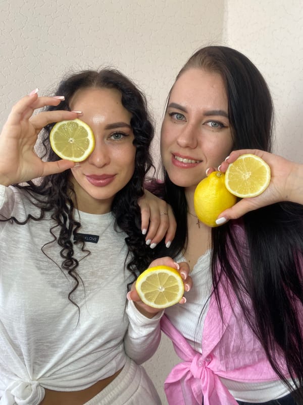 Young women stage playful lemon photoshoot in Chaikovsky, Russia