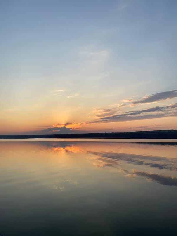 Sunset witnessed over water in Chaikovsky, Russia