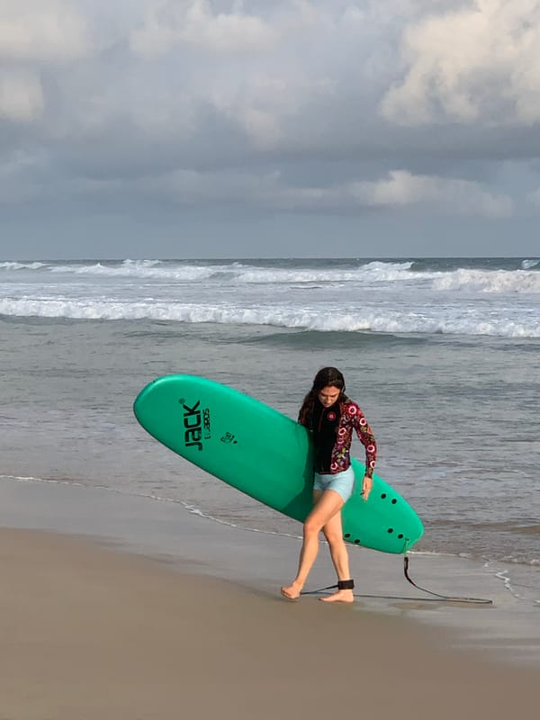 Casual beach day unfolds at Kathaluwa with surfers, dogs