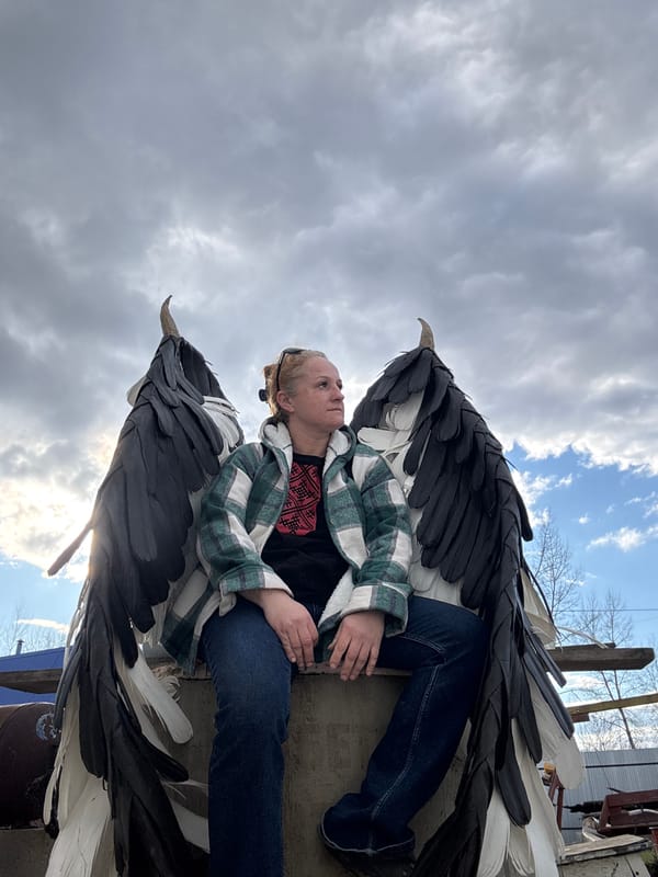 Woman poses with artificial wings in Chaikovsky, Russia