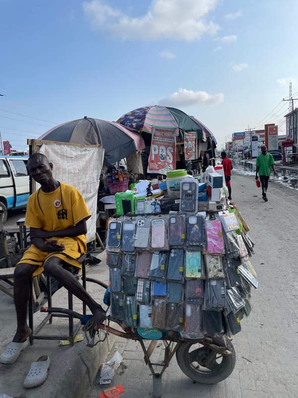 Lekki street commerce and everyday movement on a wet afternoon