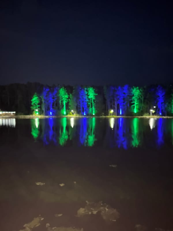 Colorful nighttime lighting event at Lake Turgoyak