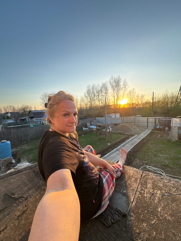 Family enjoys sunset gathering with dog in Chaikovsky, Russia