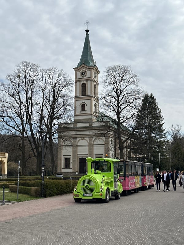 Family playground visit documented near historic church in Wisła