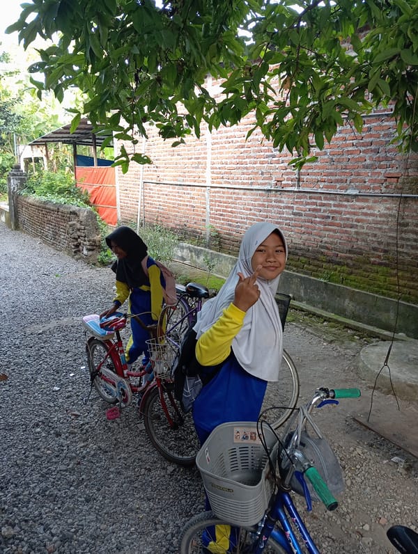 Students gather with bicycles in Baron, Indonesia