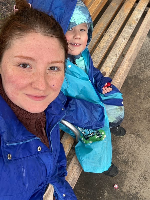 Mother and child share quiet moment on bench in Russia