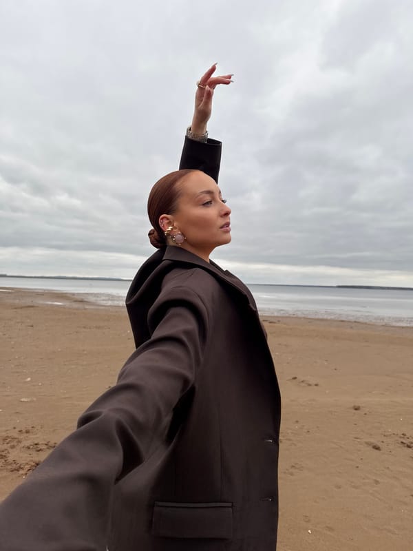 Woman photographed in contemplative beach portraits in Chaikovsky, Russia
