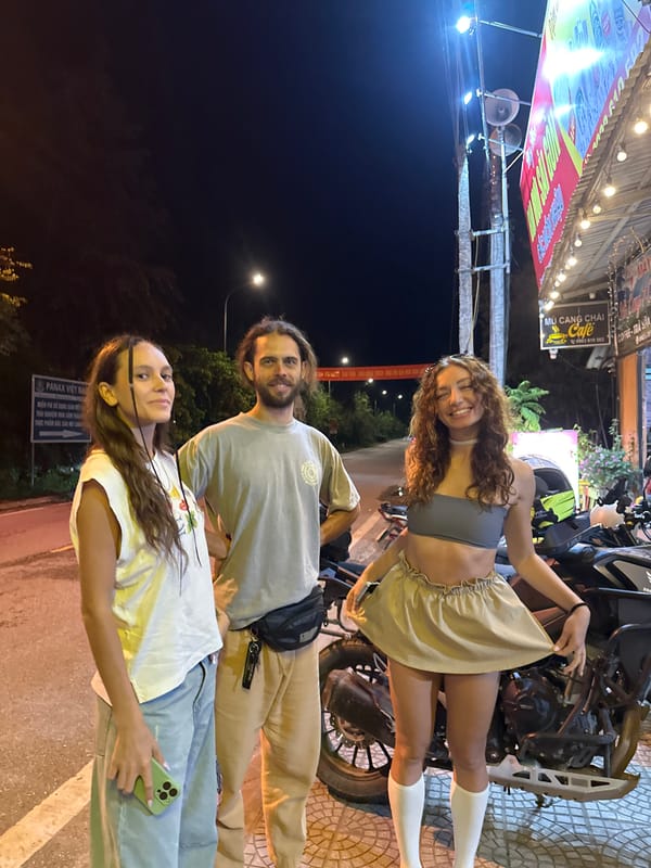 Friends pose for nighttime photos on Mù Cang Chải street