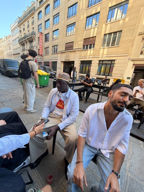 Parisians gather at outdoor tables for afternoon conversations