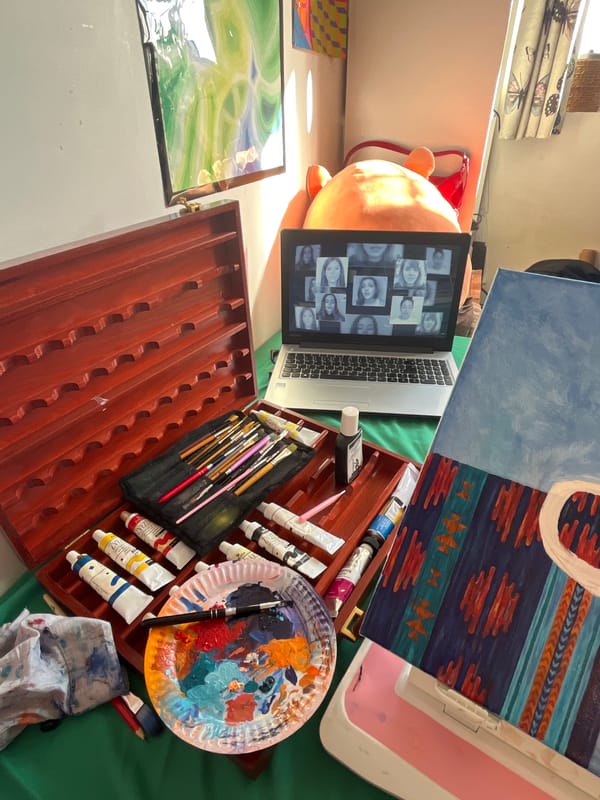 Artist workspace documented in London showing digital devices, art supplies