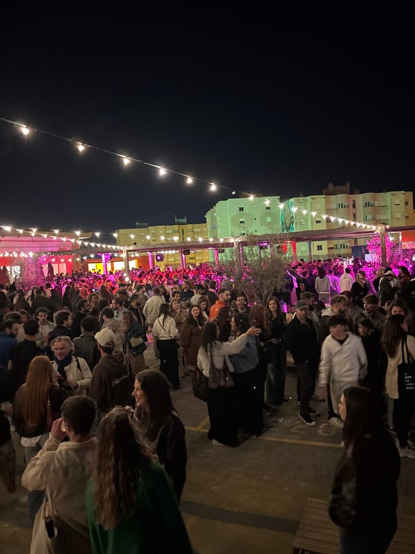 Large crowd gathers at nighttime outdoor venue in Lisbon