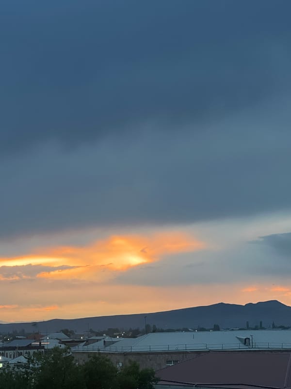 Sunset observed over Vagharshapat with mountain backdrop