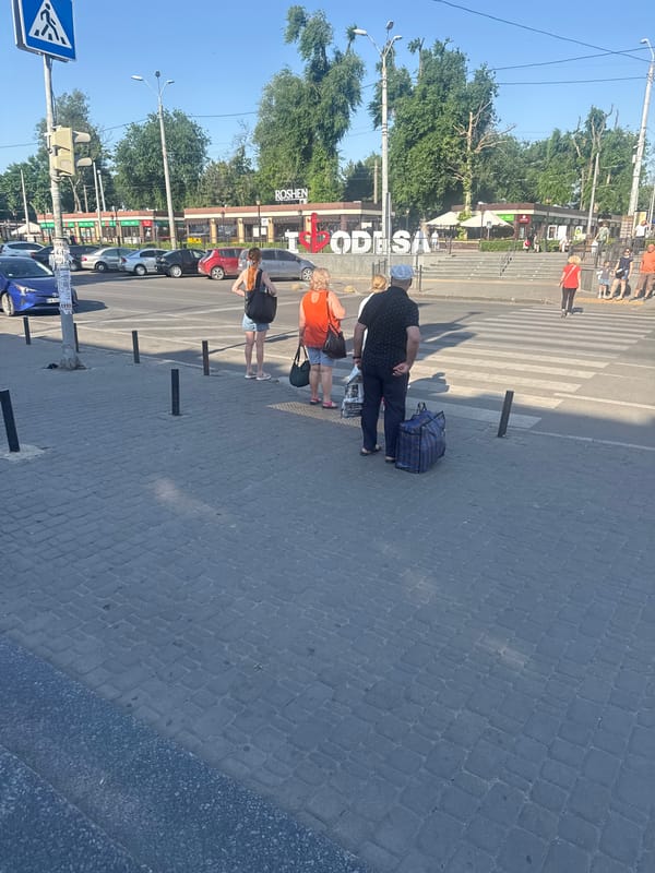 Sunny day foot traffic near Odesa's iconic 'I Love Odesa' sign