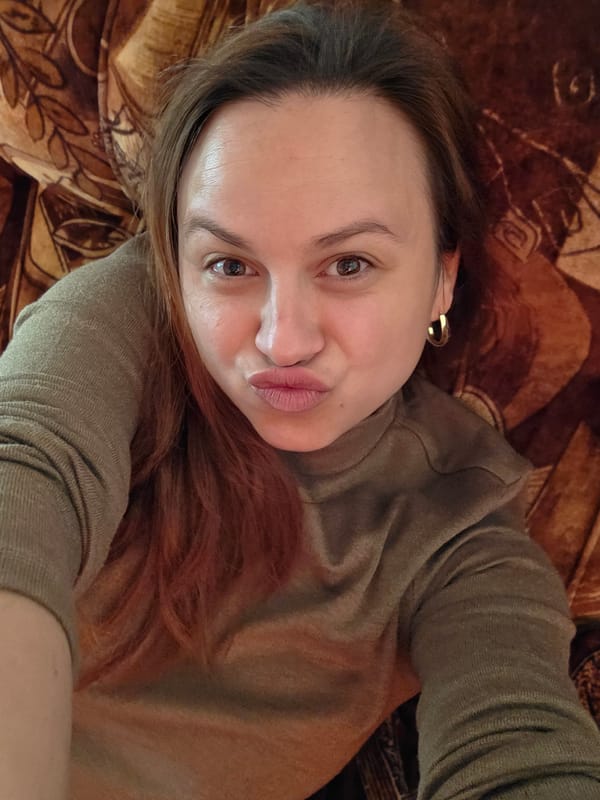 Woman photographed resting on couch in casual indoor setting