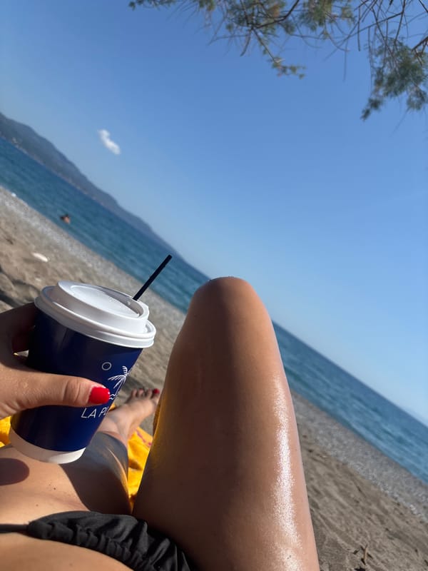 Beachgoer enjoys sunny afternoon on Kalamata shores