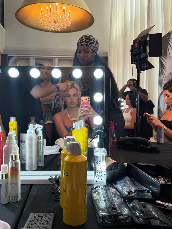 Backstage preparations captured at Miami Swim Week event