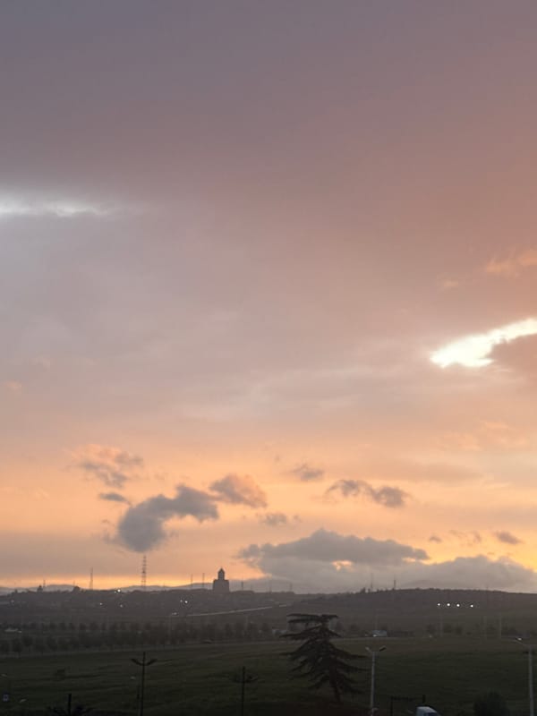 Colorful sky gradient observed over Tbilisi cityscape