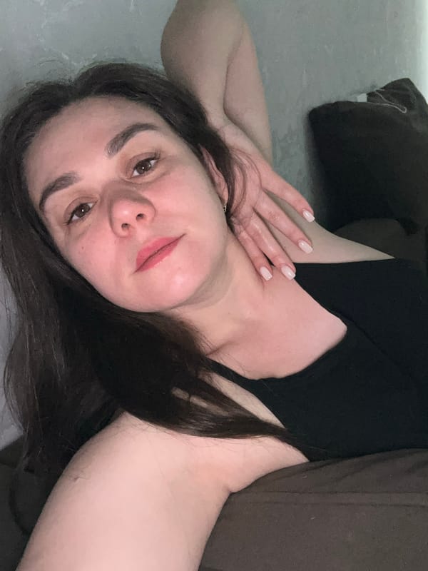 Woman resting indoors captured in Chaikovsky, Russia