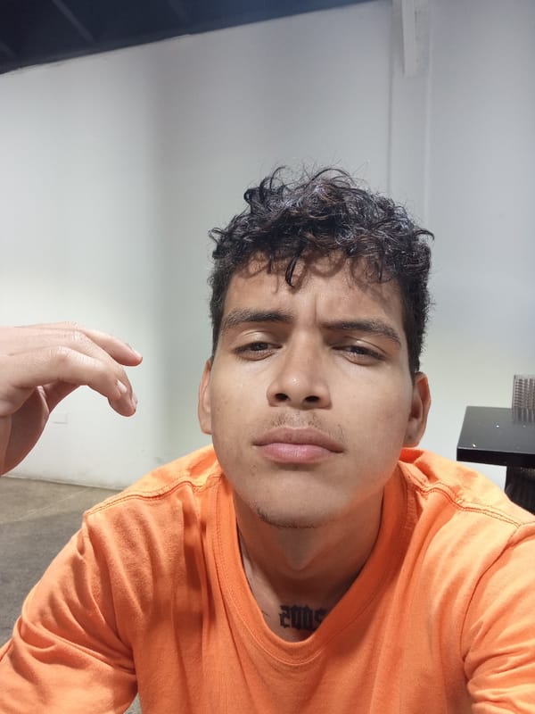 Man gets haircut, takes selfie at Venezuelan barber shop