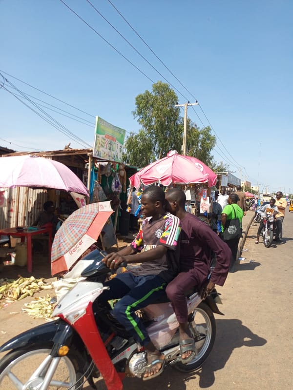 Busy market streets and motorcycle traffic across Gombe, Nigeria