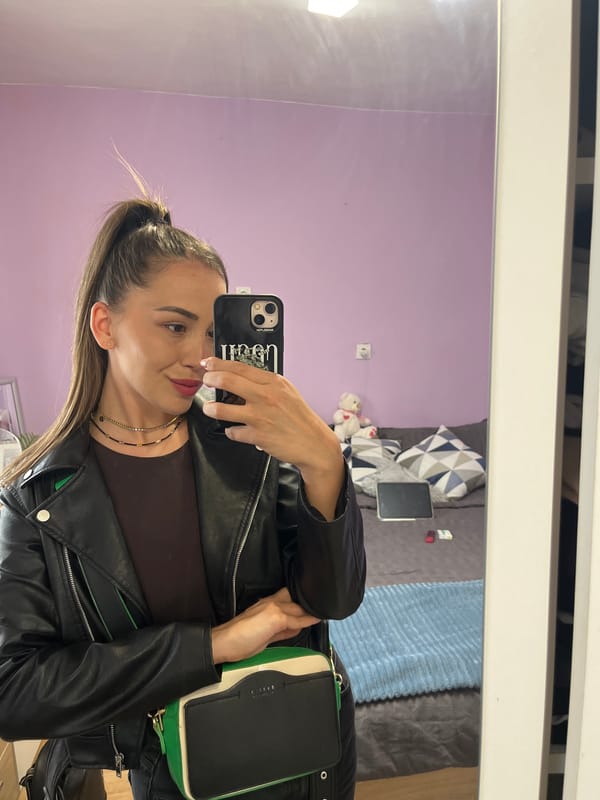 Woman takes mirror selfie in Troyan, Bulgaria